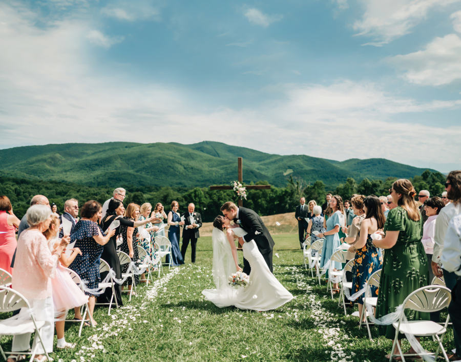 A ceremony moment, guests seated in the mountain light