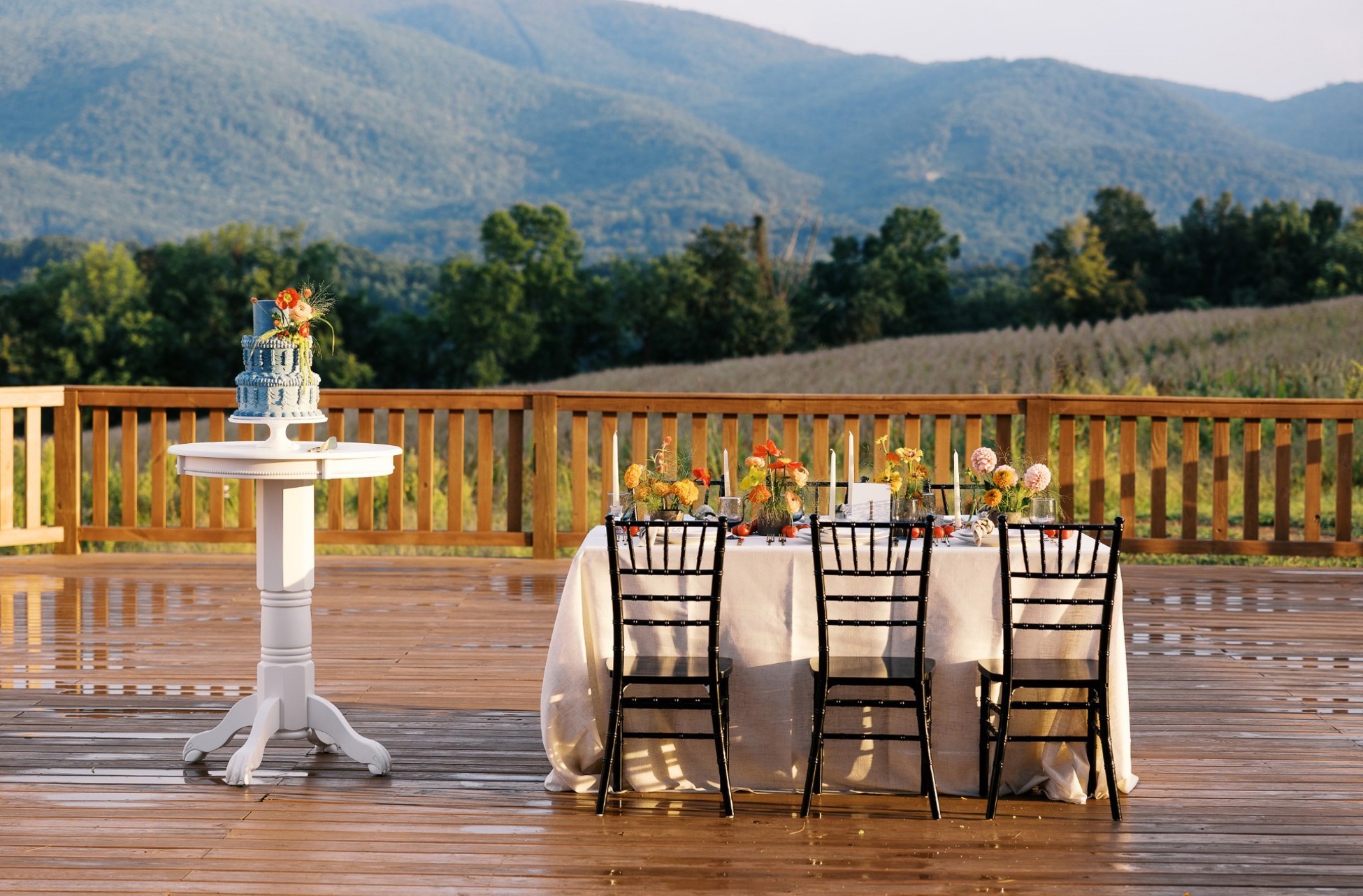 A long table set outdoors at dusk