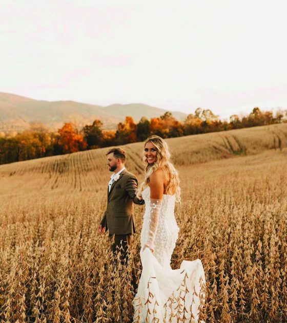 A couple walking out through the autumn field