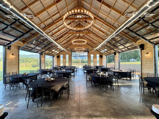 The Grand Hall set for dinner, mountains through the windows
