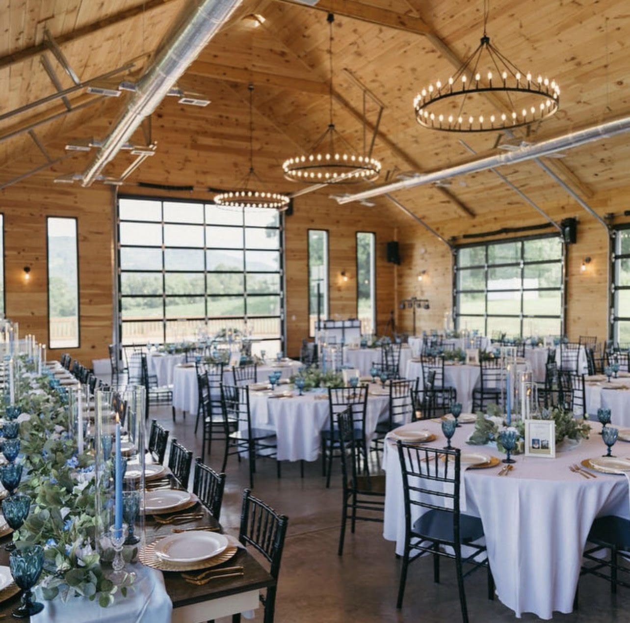 The pavilion set for dinner, mountains through the doors