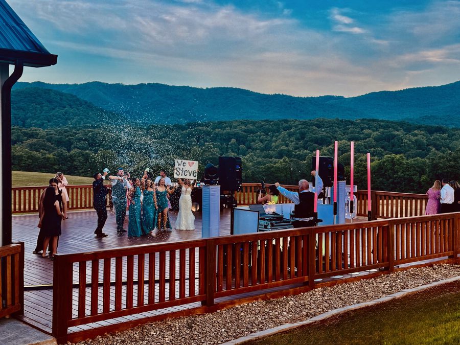 A welcome gathering on the terrace, mountains beyond