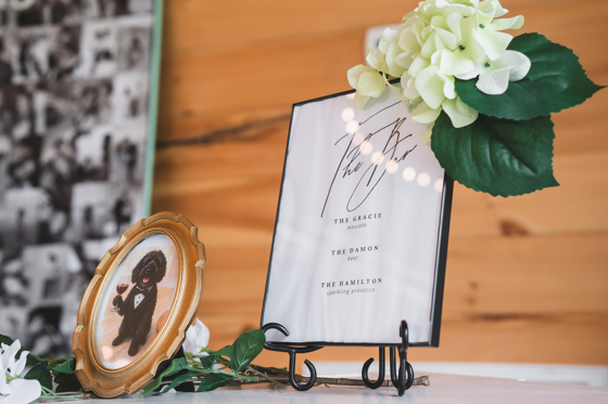 Paper details and florals on the welcome table