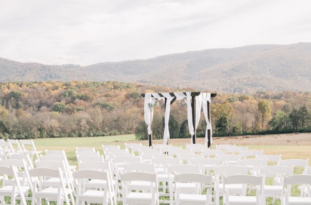 Ceremony chairs and the arbor in autumn color